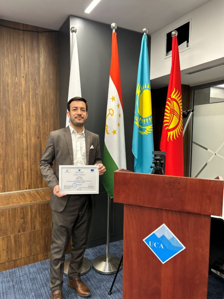 Engr. Shafi Ullah holding his Certificate of Achievement at the University of Central Asia in Bishkek