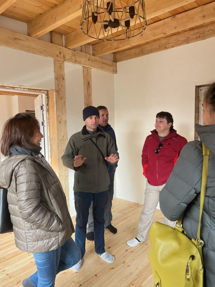 Timber posts and beams inside the eco-building during the site visit